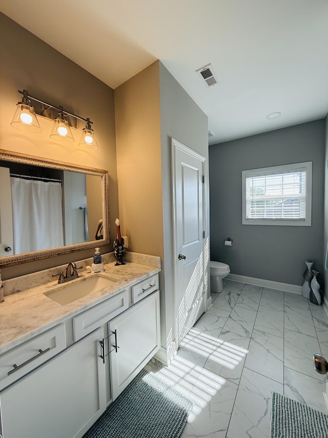 627 Fourwinds Dr, Richmond, KY 40475 - full bath with marble finish flooring, vanity, toilet, and baseboards