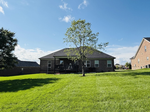 627 Fourwinds Dr, Richmond, KY 40475 - rear view of house featuring a yard, brick siding, and a shingled roof