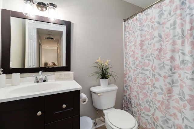 913 W 8th St, Corbin, KY 40701 - bathroom with toilet, vanity, and a shower with shower curtain