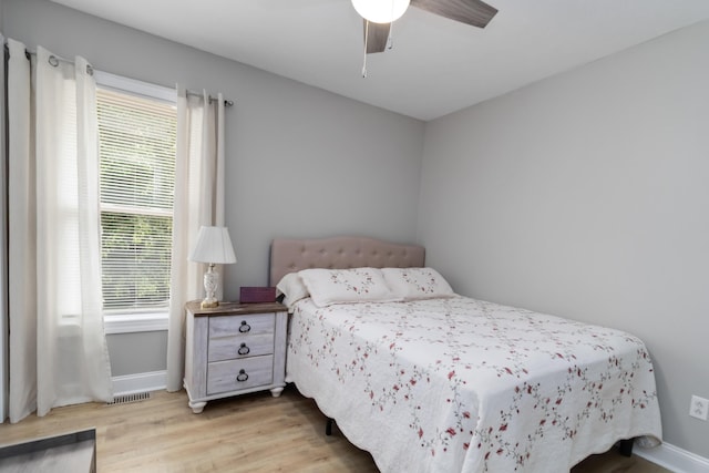 913 W 8th St, Corbin, KY 40701 - bedroom with baseboards, wood finished floors, and ceiling fan