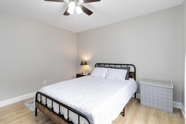 913 W 8th St, Corbin, KY 40701 - bedroom with baseboards, wood finished floors, and ceiling fan