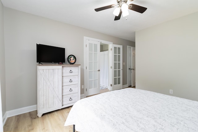 913 W 8th St, Corbin, KY 40701 - bedroom featuring light wood-type flooring, baseboards, french doors, and ceiling fan