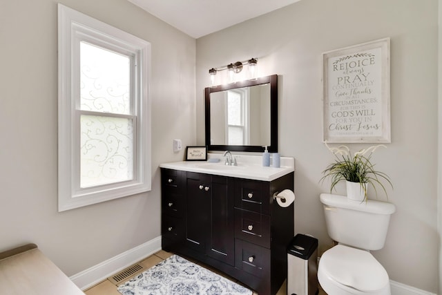 913 W 8th St, Corbin, KY 40701 - bathroom featuring vanity, toilet, baseboards, and tile patterned flooring