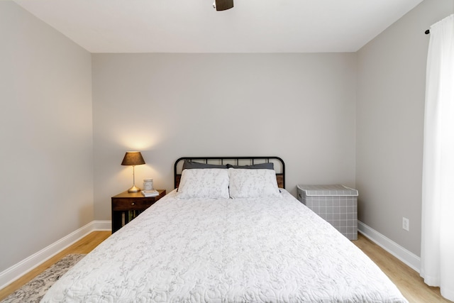 913 W 8th St, Corbin, KY 40701 - bedroom with light wood finished floors, baseboards, and ceiling fan