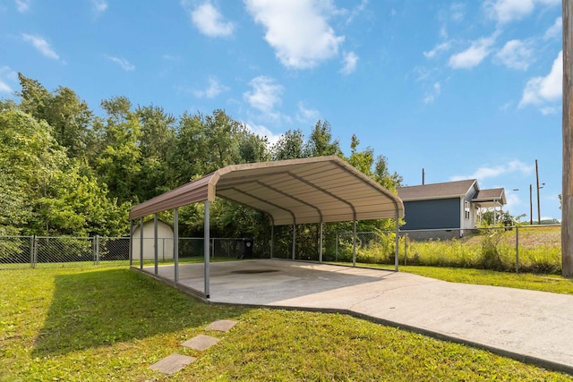 913 W 8th St, Corbin, KY 40701 - view of parking with concrete driveway, a shed, and a carport