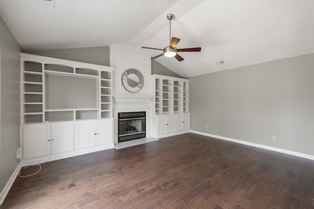 1109 Seville Ct, Lexington, KY 40515 - unfurnished living room with ceiling fan, vaulted ceiling, a glass covered fireplace, dark wood finished floors, and baseboards
