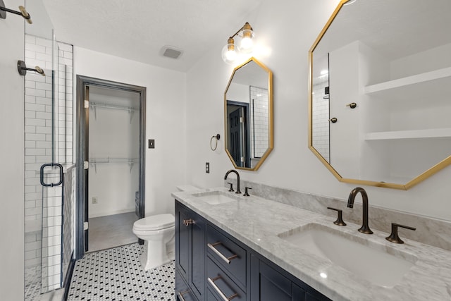 1109 Seville Ct, Lexington, KY 40515 - bathroom with double vanity, a stall shower, toilet, and a textured ceiling