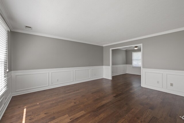 1109 Seville Ct, Lexington, KY 40515 - spare room featuring a ceiling fan, a wainscoted wall, dark wood-style flooring, and ornamental molding