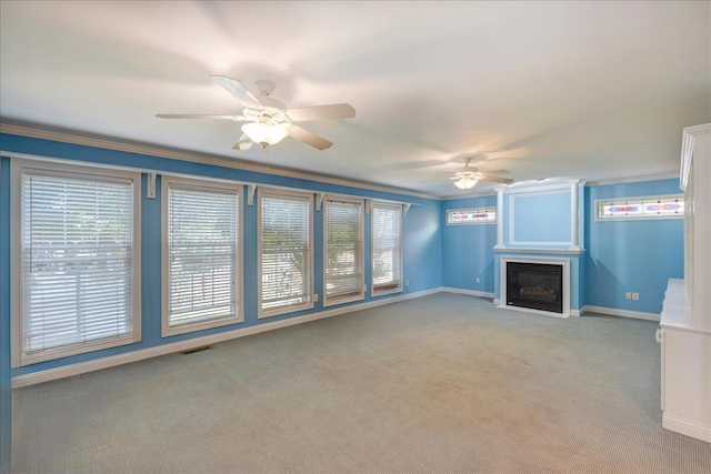 3373 Malone Dr, Lexington, KY 40513 - unfurnished living room featuring a ceiling fan, baseboards, plenty of natural light, light carpet, and ornamental molding
