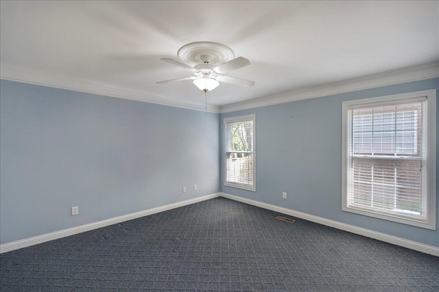 3373 Malone Dr, Lexington, KY 40513 - spare room featuring a ceiling fan, dark colored carpet, baseboards, and crown molding