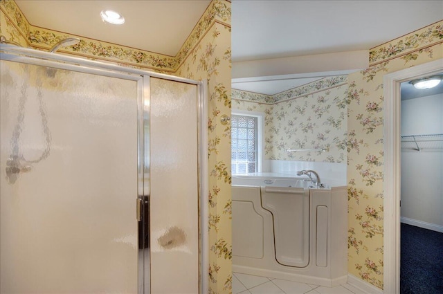 3373 Malone Dr, Lexington, KY 40513 - full bathroom with a stall shower, a garden tub, wallpapered walls, a sink, and baseboards