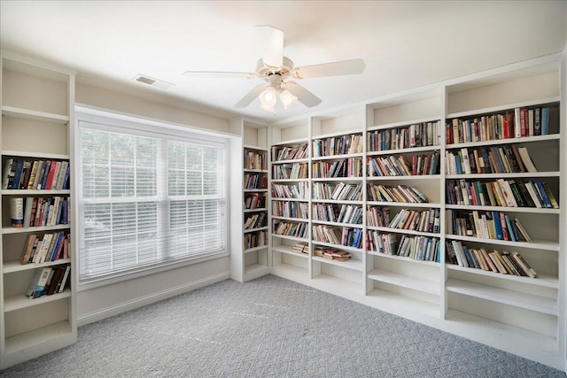 3373 Malone Dr, Lexington, KY 40513 - unfurnished room featuring bookshelves, carpet floors, and a ceiling fan
