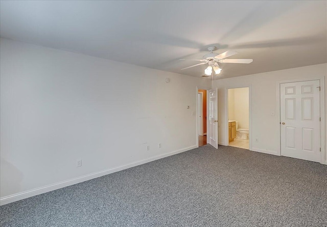 3373 Malone Dr, Lexington, KY 40513 - unfurnished bedroom featuring dark carpet, baseboards, ensuite bathroom, and ceiling fan