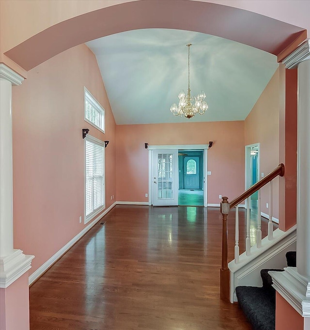 3373 Malone Dr, Lexington, KY 40513 - foyer entrance featuring decorative columns, high vaulted ceiling, wood finished floors, a chandelier, and baseboards