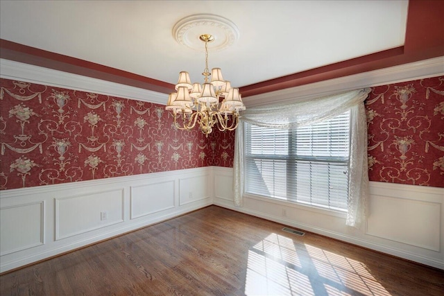 3373 Malone Dr, Lexington, KY 40513 - spare room featuring wallpapered walls, a chandelier, a wainscoted wall, and wood finished floors