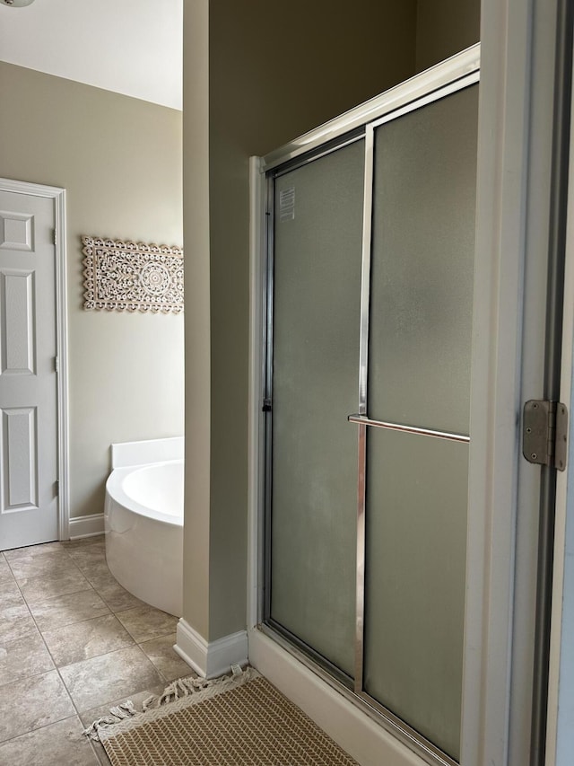 203 Whitman Way, Georgetown, KY 40324 - full bath featuring a garden tub, a shower stall, and baseboards