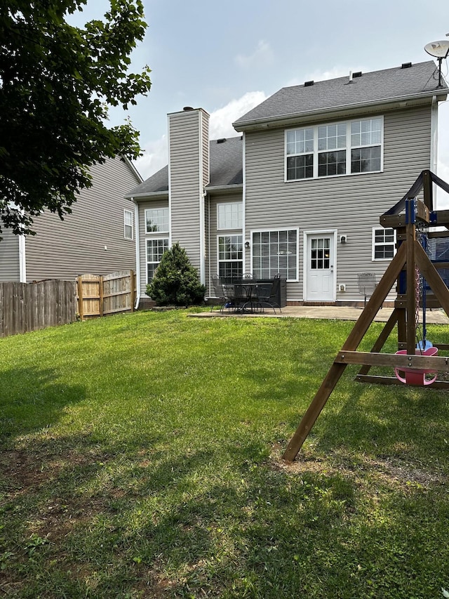 203 Whitman Way, Georgetown, KY 40324 - back of house featuring a chimney and a patio