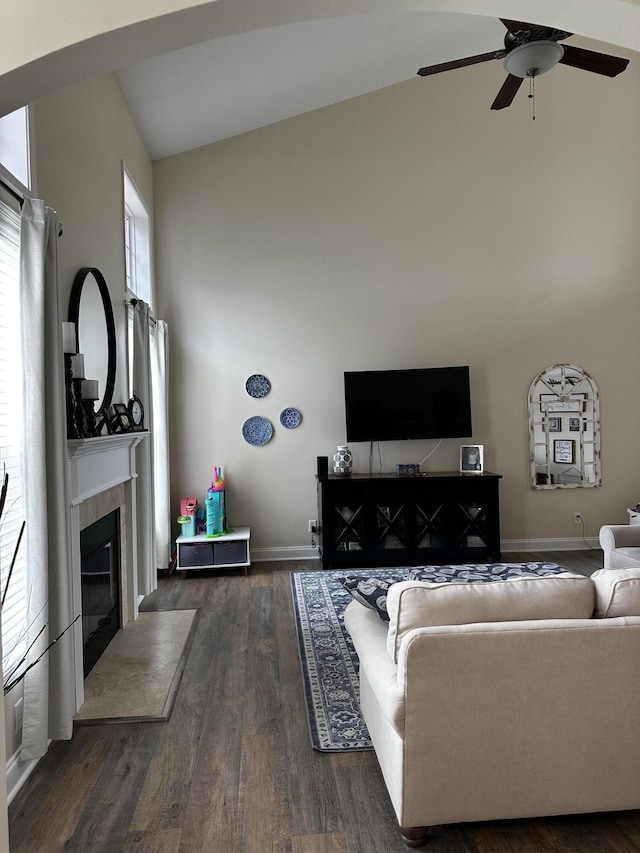 203 Whitman Way, Georgetown, KY 40324 - living room featuring high vaulted ceiling, a tiled fireplace, a ceiling fan, dark wood-type flooring, and baseboards