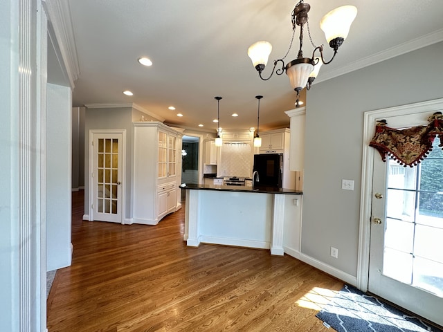 3217 Malone Dr, Lexington, KY 40513 - kitchen featuring dark countertops, ornamental molding, recessed lighting, backsplash, and refrigerator