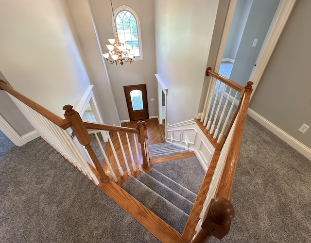 3217 Malone Dr, Lexington, KY 40513 - stairway with carpet, a chandelier, and a towering ceiling