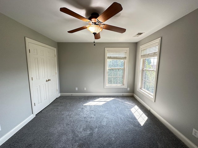 3217 Malone Dr, Lexington, KY 40513 - unfurnished bedroom featuring baseboards, dark colored carpet, and ceiling fan