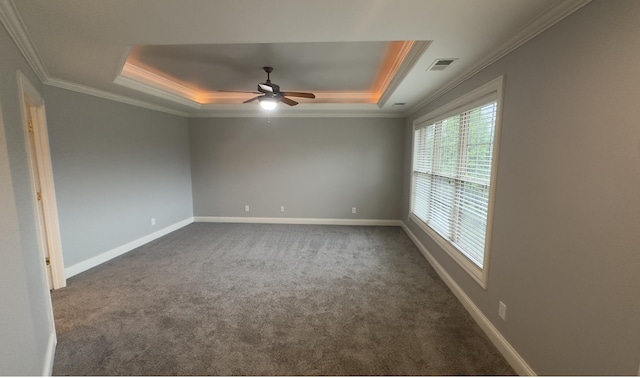 3217 Malone Dr, Lexington, KY 40513 - spare room featuring a raised ceiling, dark colored carpet, crown molding, a ceiling fan, and baseboards