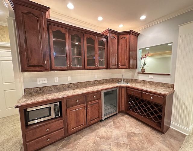 3217 Malone Dr, Lexington, KY 40513 - bar featuring stainless steel microwave, wine cooler, ornamental molding, a sink, and recessed lighting