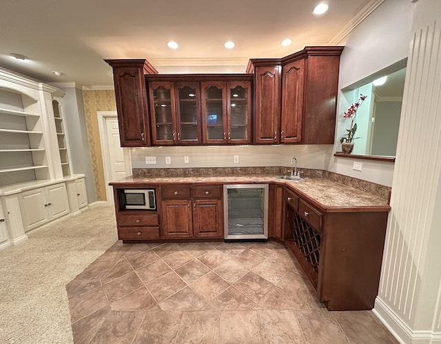 3217 Malone Dr, Lexington, KY 40513 - bar area featuring beverage cooler, stainless steel microwave, crown molding, a sink, and recessed lighting