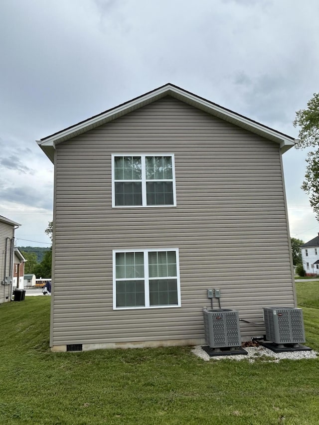 275 Broadway St A-B, Unit A-B Irvine, KY 40336 - view of side of property featuring a cooling unit and a lawn
