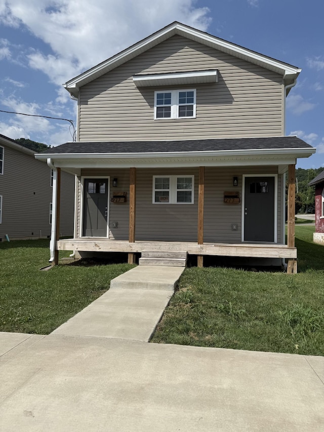 277 Broadway St A-B, Unit A-B Irvine, KY 40336 - view of front of home with covered porch and a front yard