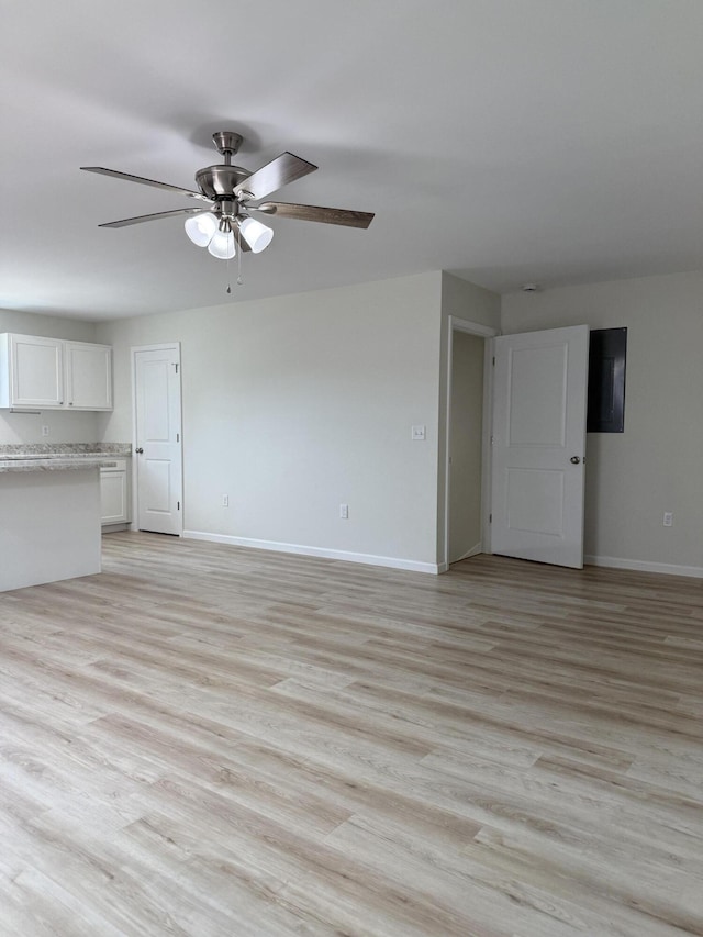 277 Broadway St A-B, Unit A-B Irvine, KY 40336 - unfurnished living room featuring a ceiling fan and light wood-style floors