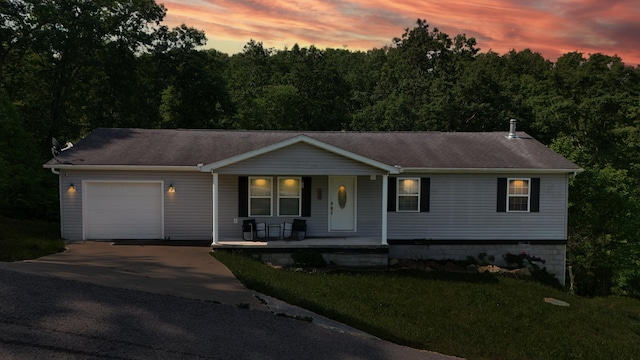 15 April Ln, Corbin, KY 40701 - ranch-style house featuring a porch, a garage, driveway, a yard, and roof with shingles