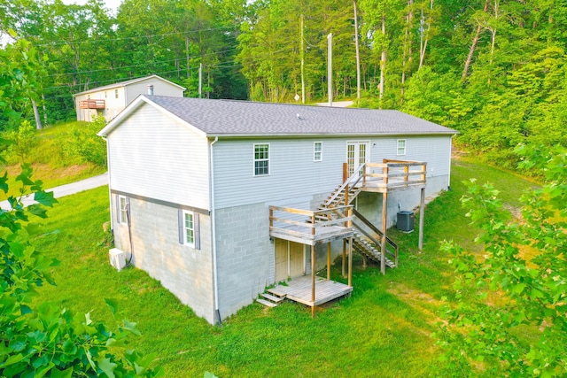15 April Ln, Corbin, KY 40701 - rear view of house with stairs, a wooden deck, a yard, and central AC