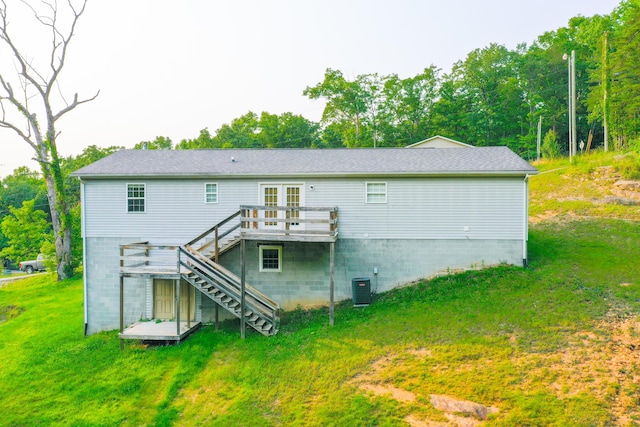 15 April Ln, Corbin, KY 40701 - back of property featuring stairs, a wooden deck, central air condition unit, and a lawn