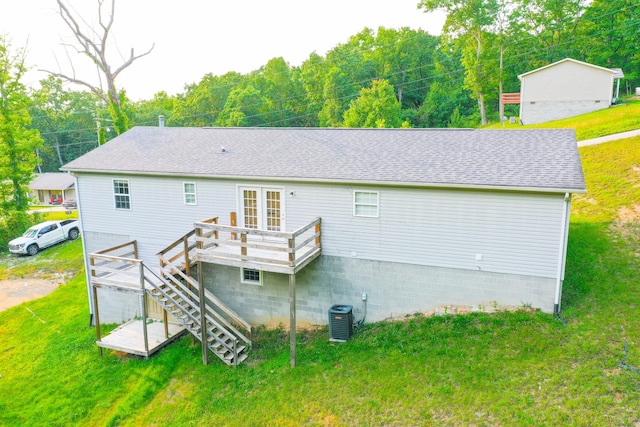 15 April Ln, Corbin, KY 40701 - back of house featuring a wooden deck, a yard, cooling unit, stairway, and roof with shingles