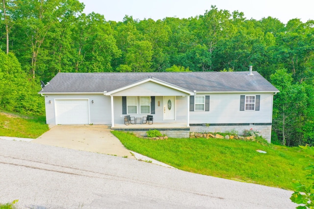 15 April Ln, Corbin, KY 40701 - ranch-style house with a porch, driveway, a garage, and a wooded view