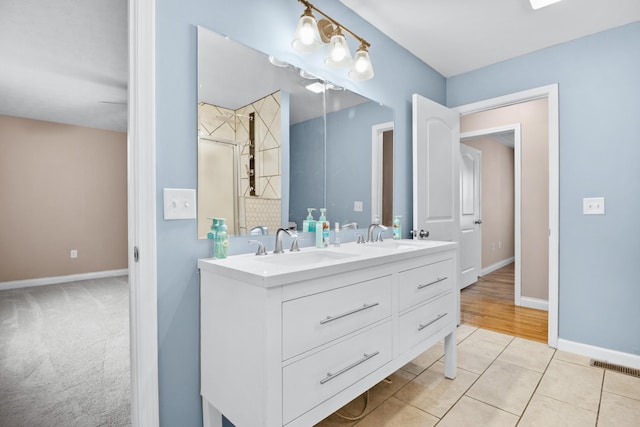 15 April Ln, Corbin, KY 40701 - full bath with double vanity, a stall shower, baseboards, and tile patterned floors