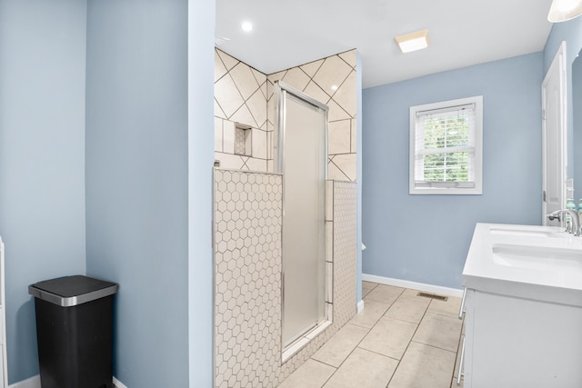 15 April Ln, Corbin, KY 40701 - bathroom with vanity, a shower stall, tile patterned flooring, baseboards, and recessed lighting