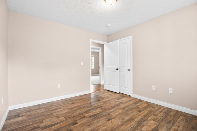 15 April Ln, Corbin, KY 40701 - unfurnished bedroom with wood finished floors, baseboards, and a closet