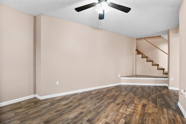15 April Ln, Corbin, KY 40701 - empty room featuring wood finished floors, ceiling fan, baseboards, and stairs