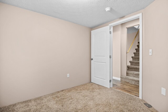 15 April Ln, Corbin, KY 40701 - basement featuring light colored carpet and stairway