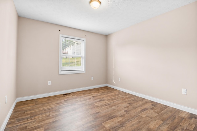 15 April Ln, Corbin, KY 40701 - unfurnished room featuring wood finished floors and baseboards