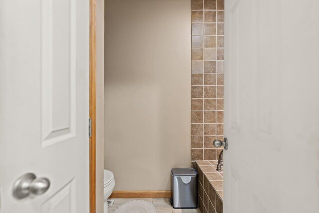 2003 Cresent Cir, Corbin, KY 40701 - full bath with toilet, baseboards, and tile patterned floors