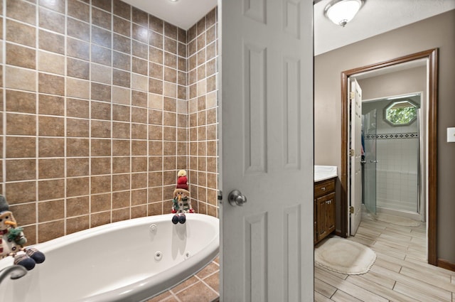 2003 Cresent Cir, Corbin, KY 40701 - bathroom with a tub with jets, vanity, and wood finished floors