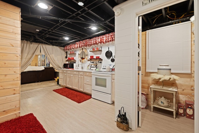 2003 Cresent Cir, Corbin, KY 40701 - kitchen featuring white electric range, wooden walls, open floor plan, light wood-type flooring, and light countertops