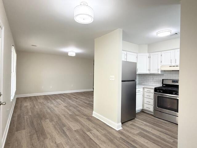 3501 Marsanne Ct, Lexington, KY 40515 - kitchen featuring appliances with stainless steel finishes, under cabinet range hood, light wood-style floors, and baseboards