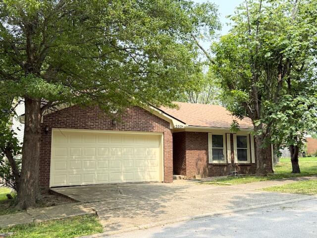 3501 Marsanne Ct, Lexington, KY 40515 - view of front of house featuring concrete driveway, brick siding, and an attached garage