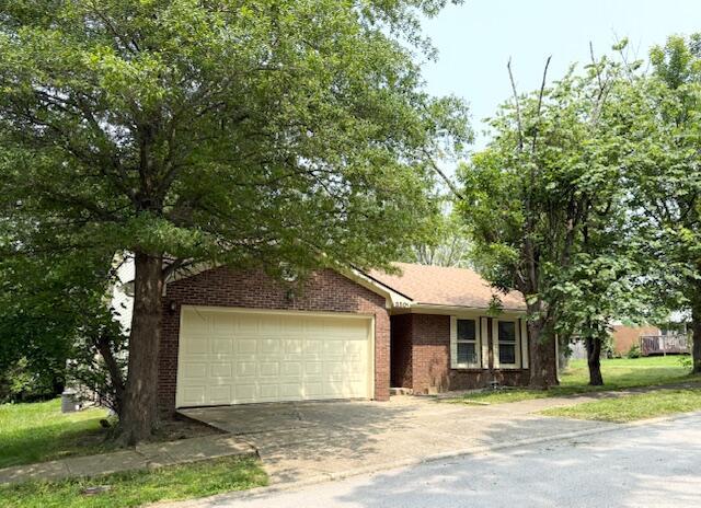 3501 Marsanne Ct, Lexington, KY 40515 - view of front of home with concrete driveway, brick siding, and a garage