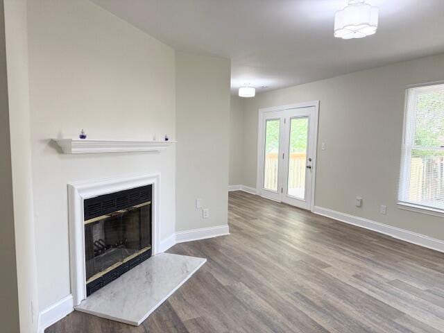 3501 Marsanne Ct, Lexington, KY 40515 - unfurnished living room with wood finished floors, plenty of natural light, and baseboards