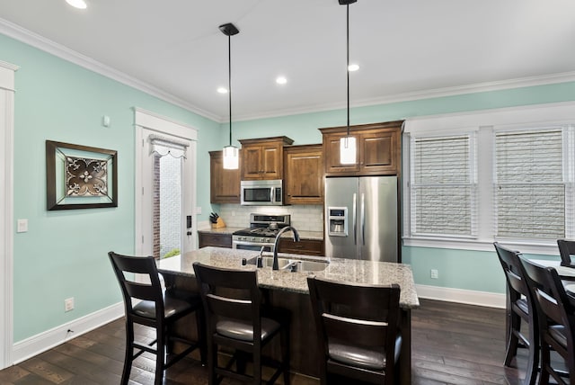 10910 Kings Crown Dr, Prospect, KY 40059 - kitchen with stainless steel appliances, a sink, baseboards, light stone countertops, and decorative backsplash
